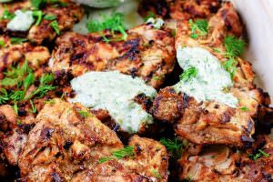 Mediterranean Grilled Chicken + Dill Greek Yogurt Sauce. Top grill recipe! Marinate boneless chicken thighs in Mediterranean spices, olive oil and lemon juice. Grill for less than 15 minutes, and serve with this flavor-packed dill yogurt sauce! Pin it to try soon!